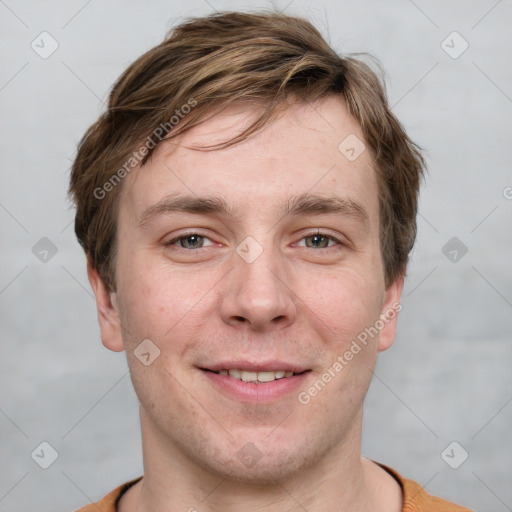 Joyful white adult male with short  brown hair and grey eyes