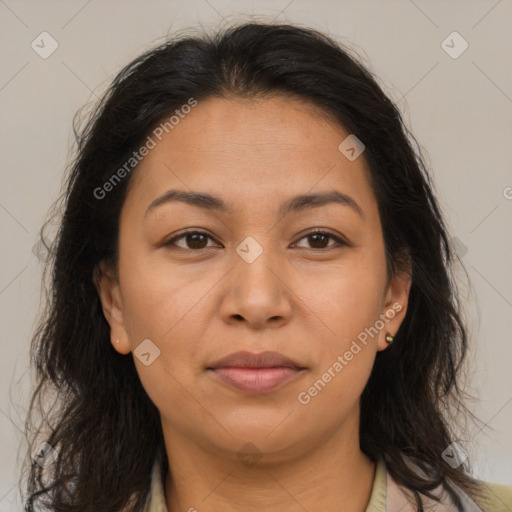 Joyful latino young-adult female with long  brown hair and brown eyes