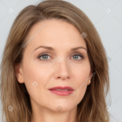 Joyful white adult female with long  brown hair and grey eyes