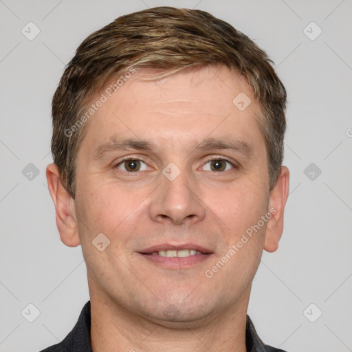 Joyful white adult male with short  brown hair and grey eyes