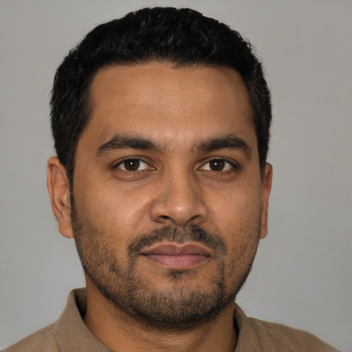 Neutral latino young-adult male with short  black hair and brown eyes