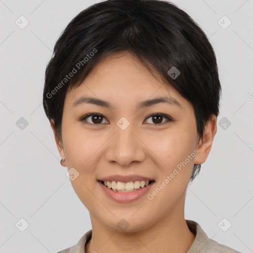 Joyful asian young-adult female with short  brown hair and brown eyes