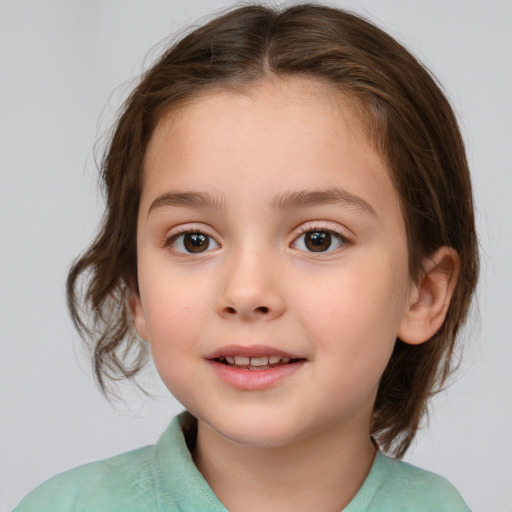 Joyful white child female with medium  brown hair and brown eyes