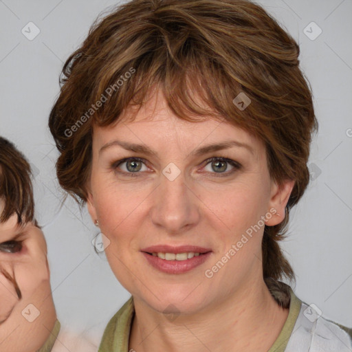 Joyful white adult female with medium  brown hair and blue eyes