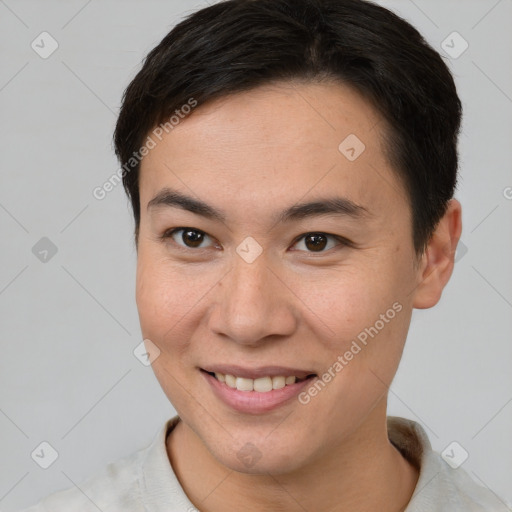 Joyful white young-adult male with short  brown hair and brown eyes