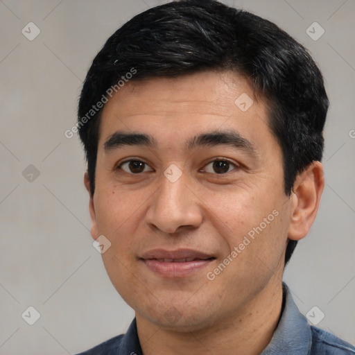 Joyful latino young-adult male with short  black hair and brown eyes