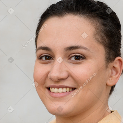 Joyful white young-adult female with short  brown hair and brown eyes