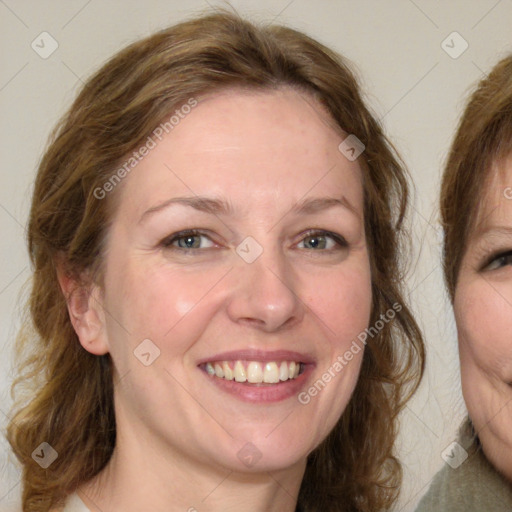 Joyful white young-adult female with medium  brown hair and green eyes