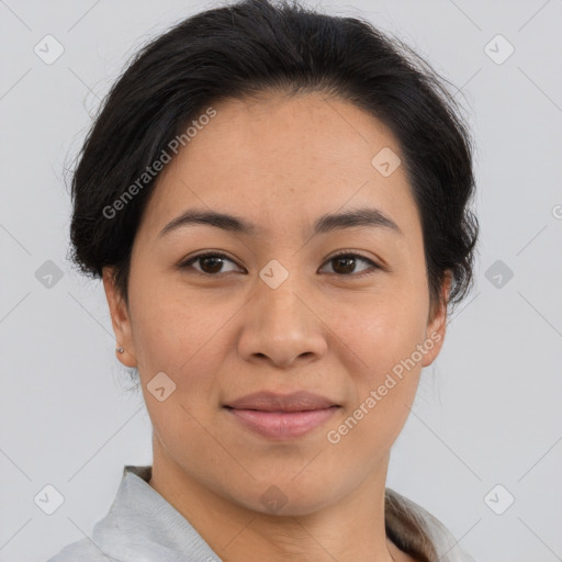 Joyful asian young-adult female with short  brown hair and brown eyes