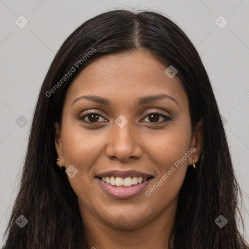 Joyful black young-adult female with long  brown hair and brown eyes