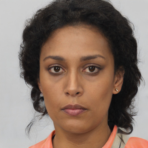 Neutral latino young-adult female with medium  brown hair and brown eyes