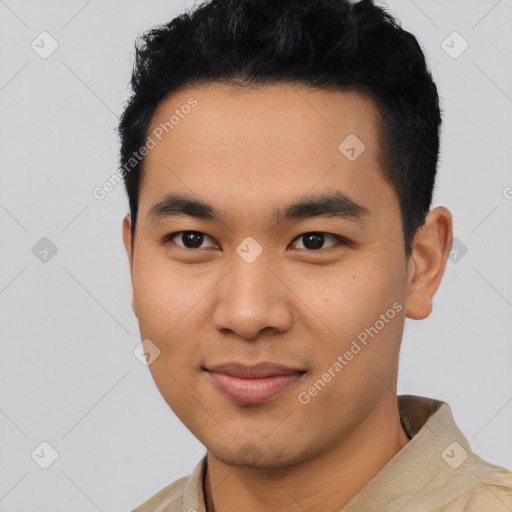 Joyful latino young-adult male with short  black hair and brown eyes