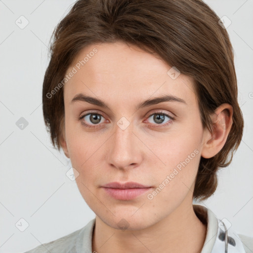 Neutral white young-adult female with medium  brown hair and grey eyes