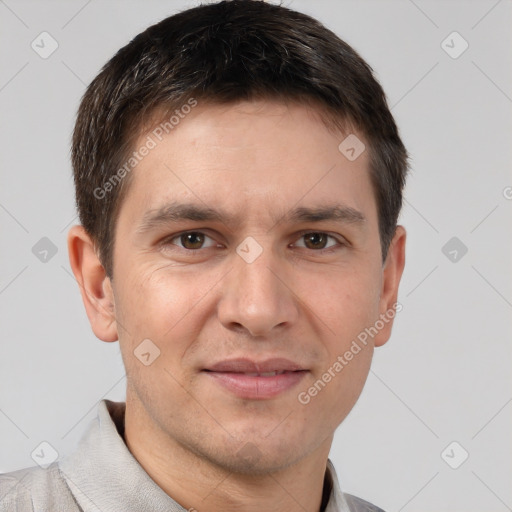 Joyful white adult male with short  brown hair and brown eyes