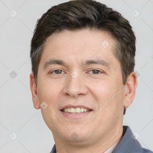 Joyful white adult male with short  brown hair and brown eyes