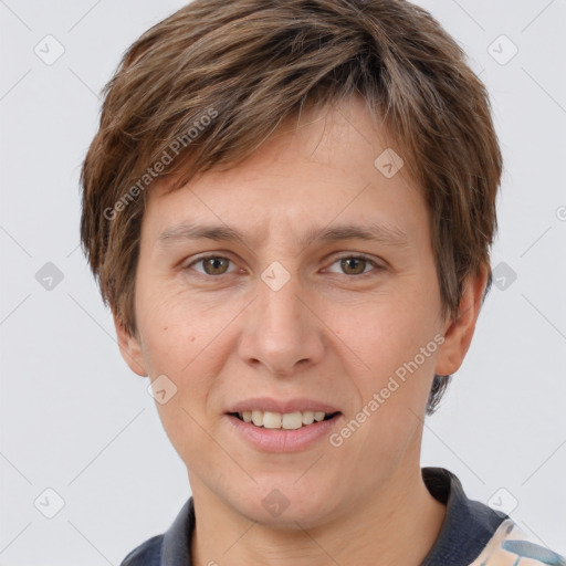 Joyful white young-adult female with short  brown hair and grey eyes