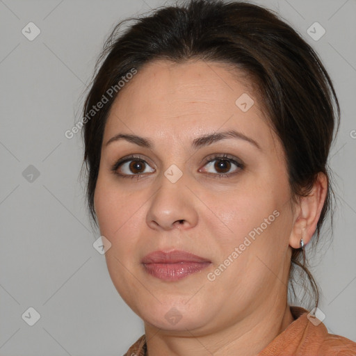 Joyful white adult female with medium  brown hair and brown eyes