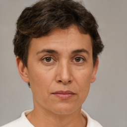 Joyful white adult female with short  brown hair and brown eyes