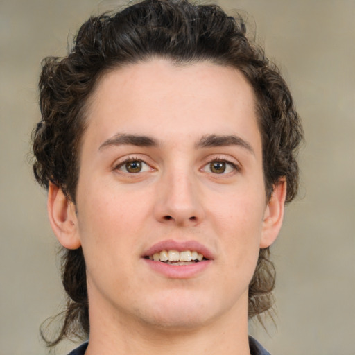 Joyful white young-adult male with medium  brown hair and brown eyes