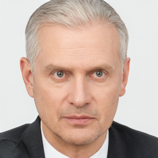 Neutral white middle-aged male with short  gray hair and brown eyes