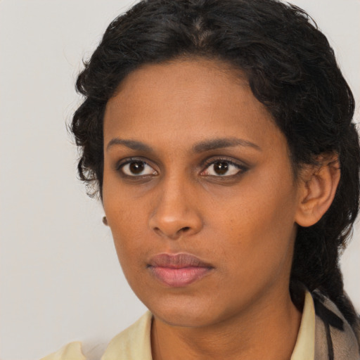 Neutral latino young-adult female with medium  brown hair and brown eyes