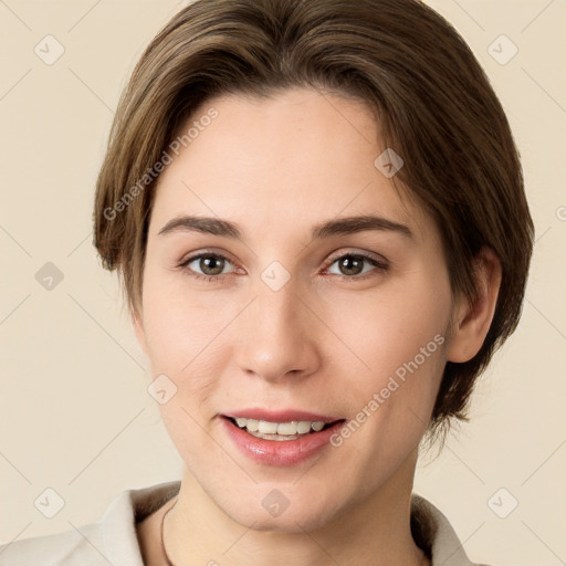 Joyful white young-adult female with short  brown hair and brown eyes