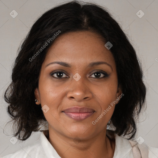 Joyful black adult female with medium  brown hair and brown eyes
