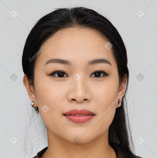 Joyful asian young-adult female with medium  black hair and brown eyes