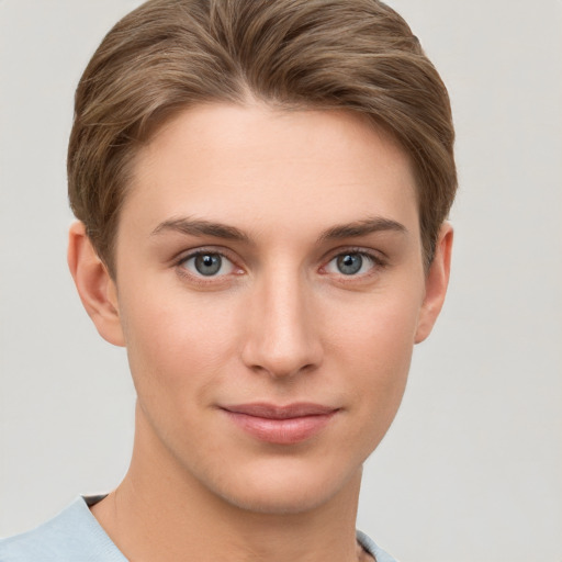 Joyful white young-adult female with short  brown hair and grey eyes