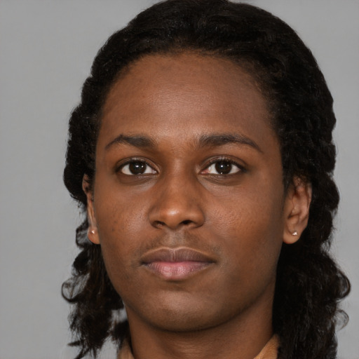 Neutral black young-adult female with medium  black hair and brown eyes