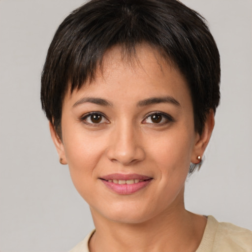 Joyful white young-adult female with short  brown hair and brown eyes