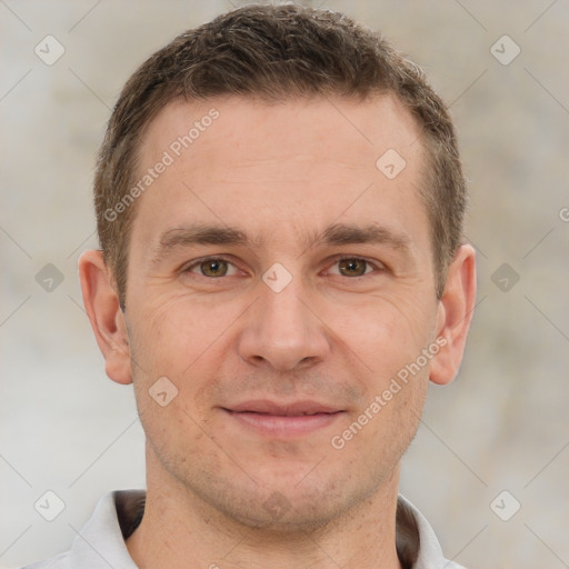 Joyful white adult male with short  brown hair and brown eyes