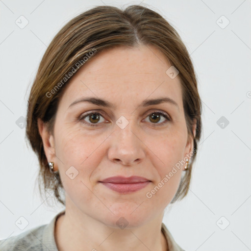 Joyful white adult female with medium  brown hair and grey eyes