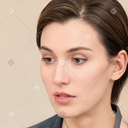 Neutral white young-adult female with long  brown hair and brown eyes