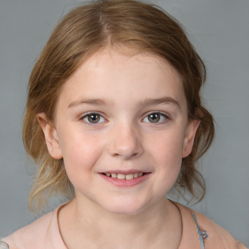 Joyful white child female with medium  brown hair and brown eyes