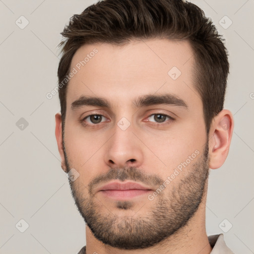 Neutral white young-adult male with short  brown hair and brown eyes