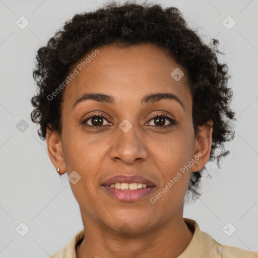 Joyful latino adult female with short  brown hair and brown eyes