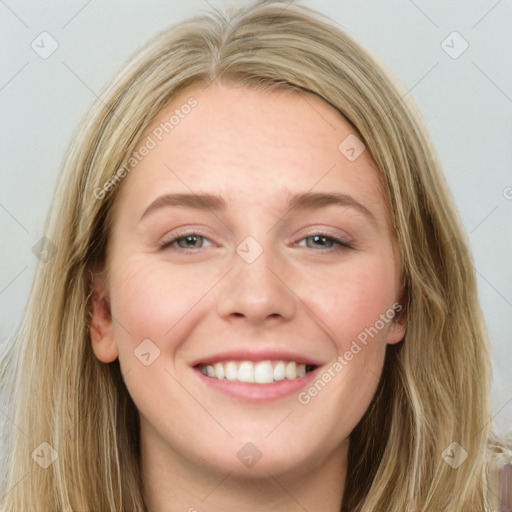 Joyful white young-adult female with long  brown hair and grey eyes