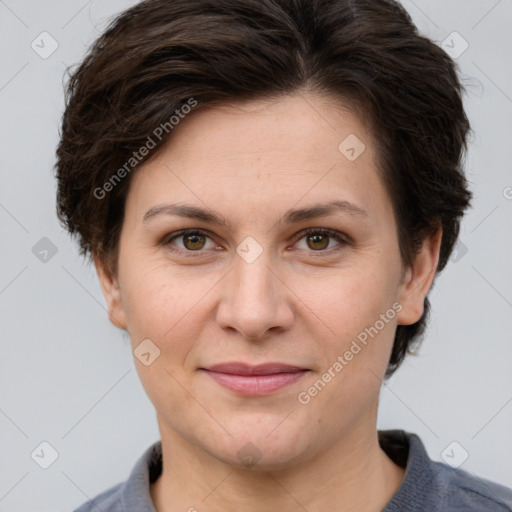 Joyful white adult female with short  brown hair and brown eyes