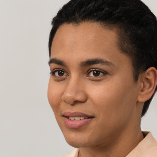 Joyful latino young-adult female with short  brown hair and brown eyes