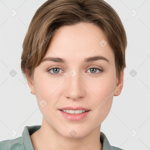 Joyful white young-adult female with short  brown hair and grey eyes