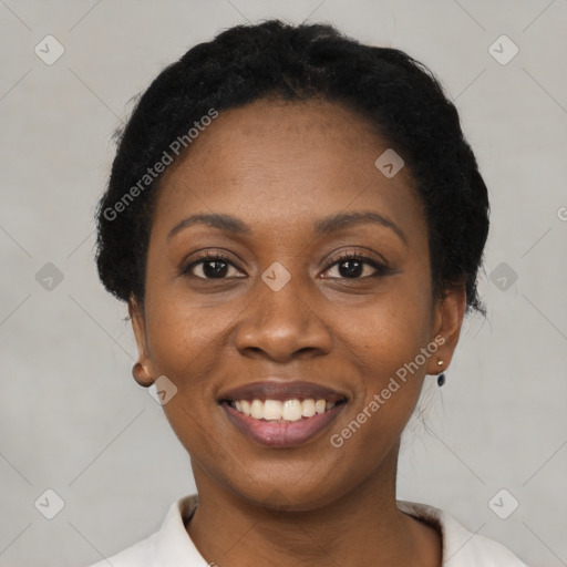 Joyful black young-adult female with short  black hair and brown eyes