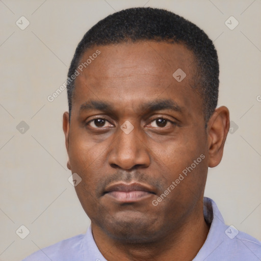 Neutral latino adult male with short  black hair and brown eyes