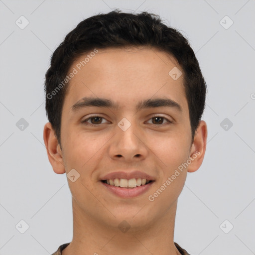 Joyful latino young-adult male with short  brown hair and brown eyes