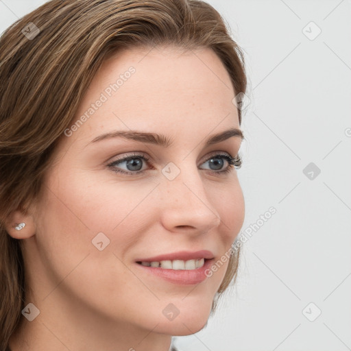 Joyful white young-adult female with long  brown hair and blue eyes