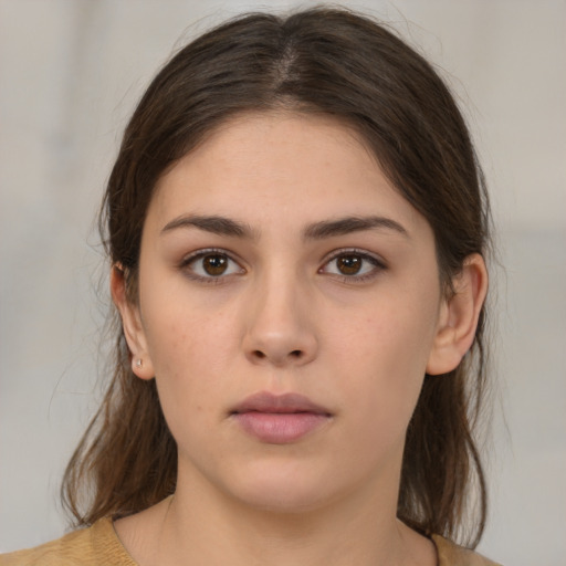 Neutral white young-adult female with medium  brown hair and brown eyes