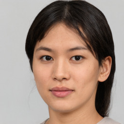 Neutral asian young-adult female with medium  brown hair and brown eyes