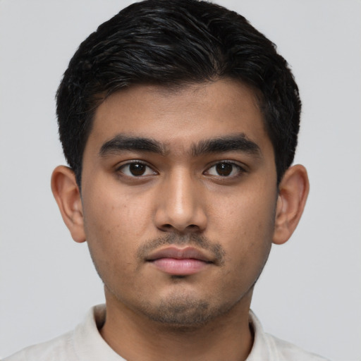 Neutral latino young-adult male with short  black hair and brown eyes