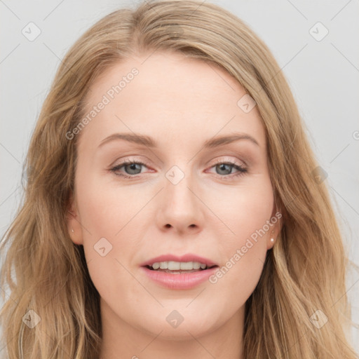 Joyful white young-adult female with long  brown hair and blue eyes