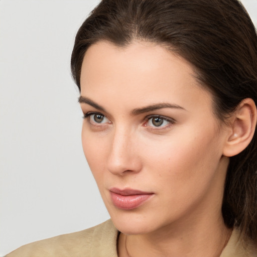 Neutral white young-adult female with medium  brown hair and brown eyes